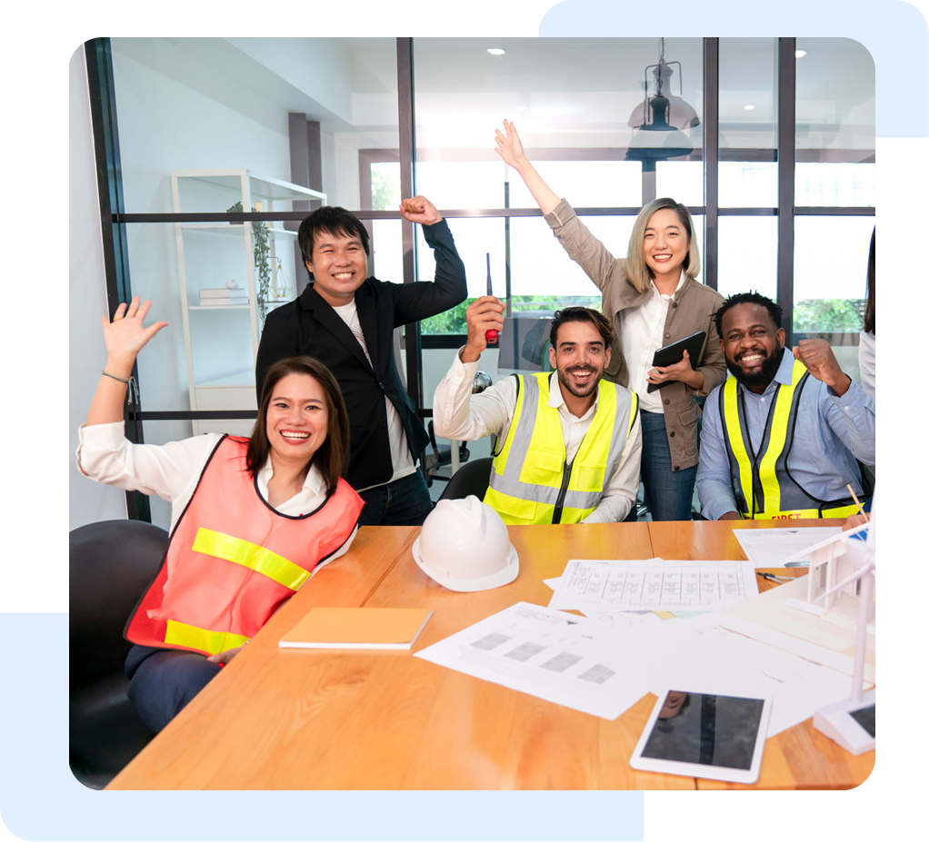 Diverse team celebrating in an office setting.